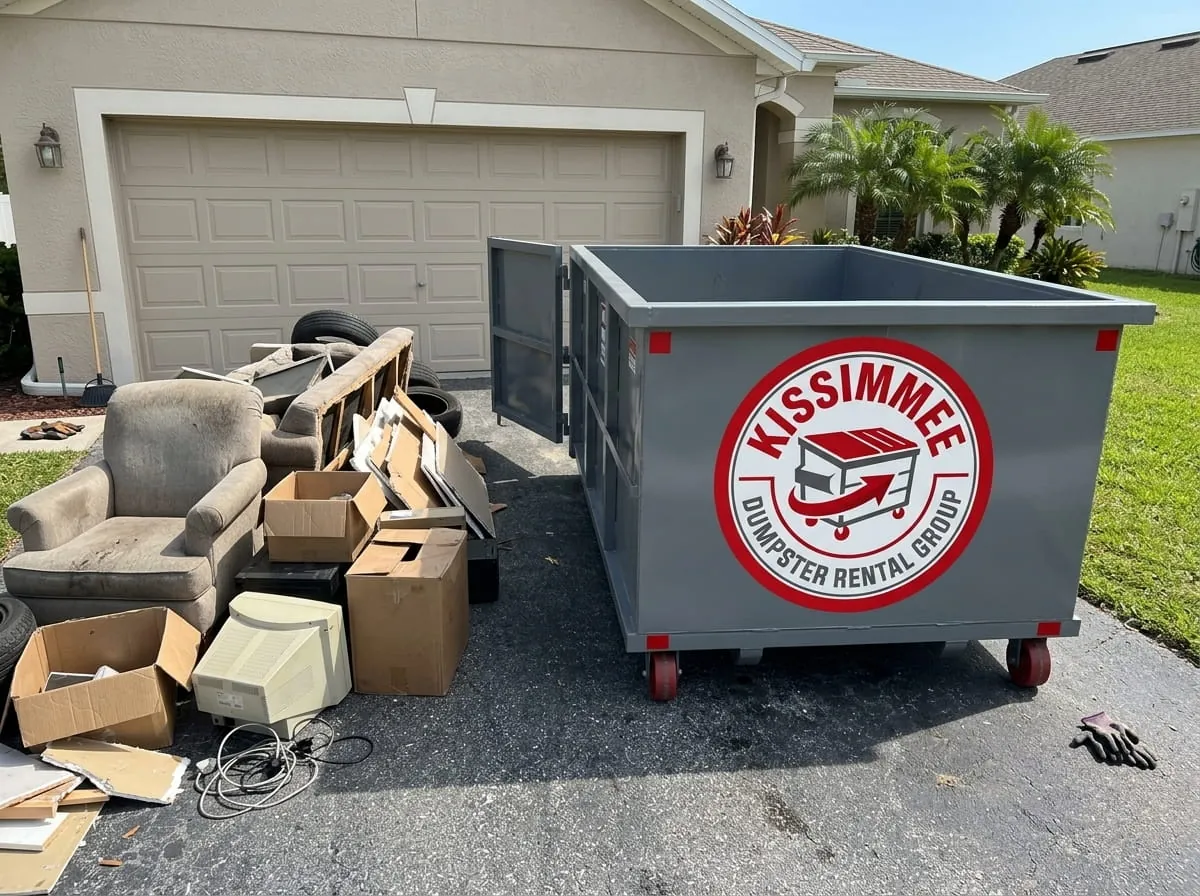 Household junk, furniture and boxes piled beside a roll-off dumpster on a Kissimmee driveway Household junk, furniture and boxes piled beside a roll-off dumpster on a Kissimmee driveway